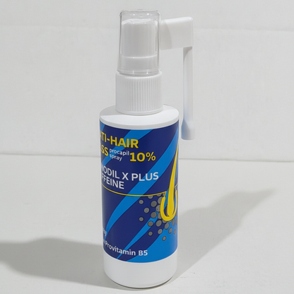 A white plastic spray bottle of hair growth spray with a blue and yellow label, set against a plain white background.